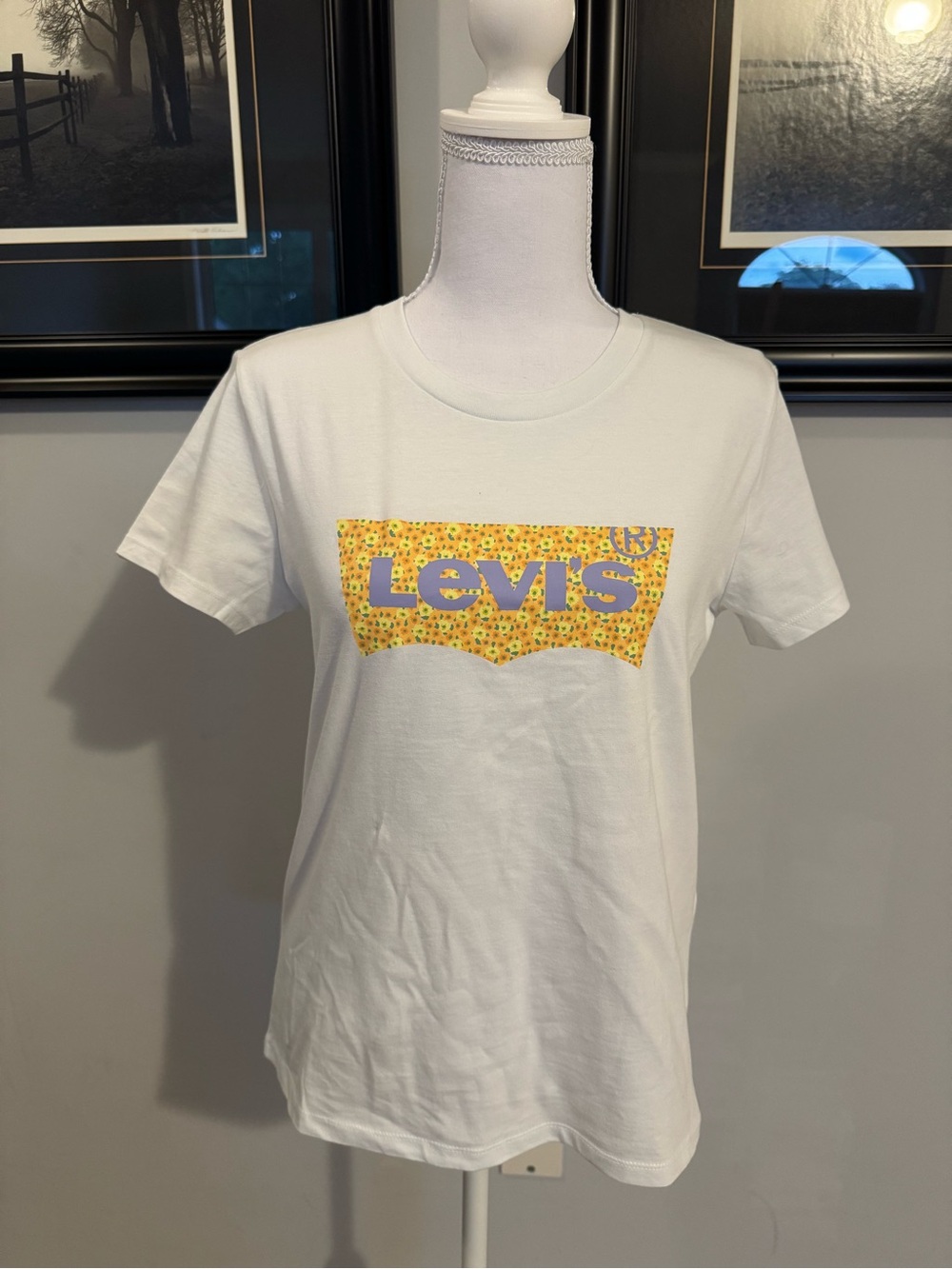 Levi's White Short-Sleeve Tee with Yellow Floral Logo and Purple Lettering